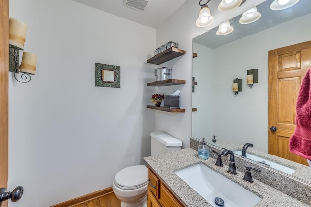 3368 Charlemaine Dr, Aurora, IL 60504 - half bath with toilet, vanity, and wood finished floors