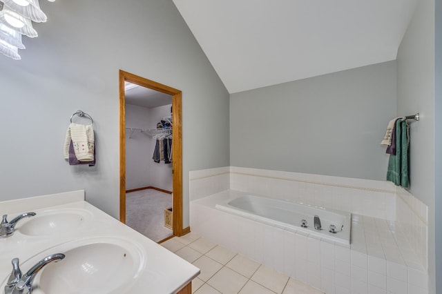 3368 Charlemaine Dr, Aurora, IL 60504 - full bathroom with a garden tub, lofted ceiling, double vanity, a walk in closet, and tile patterned floors