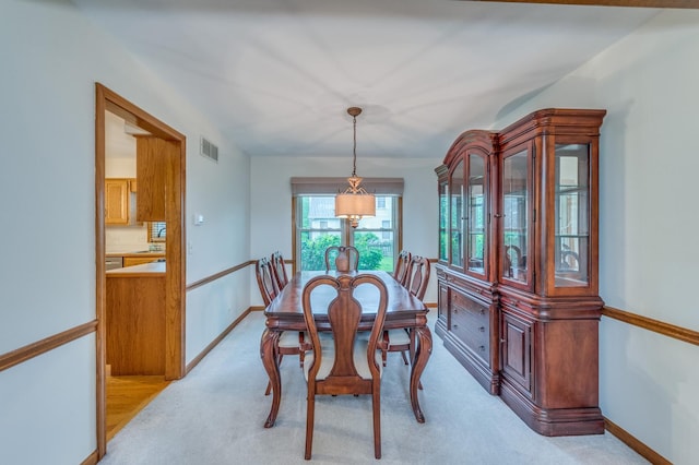 3368 Charlemaine Dr, Aurora, IL 60504 - dining space with baseboards and light colored carpet