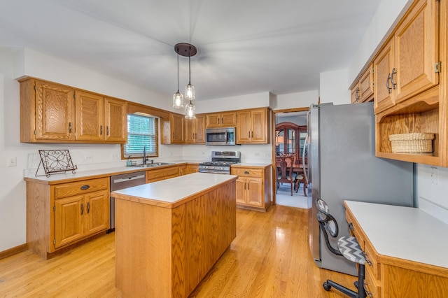 3368 Charlemaine Dr, Aurora, IL 60504 - kitchen with stainless steel appliances, light wood-style floors, a sink, light countertops, and a center island