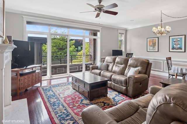 5051 N Clark St Unit 2S, Chicago, IL 60640 - living room featuring ornamental molding, a ceiling fan, a chandelier, wood finished floors, and wainscoting