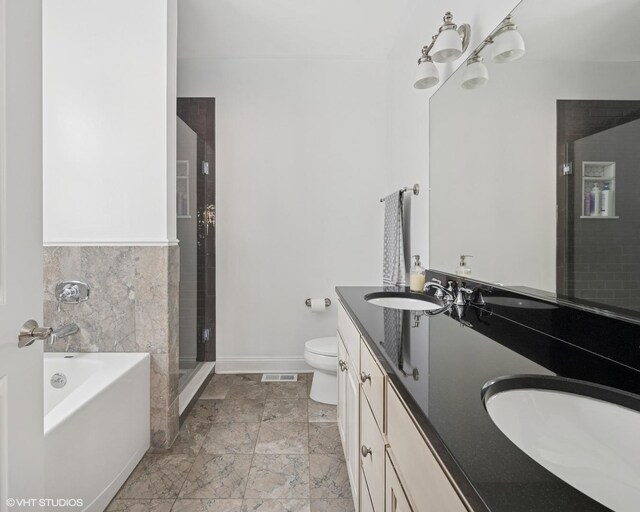 5051 N Clark St Unit 2S, Chicago, IL 60640 - full bathroom with double vanity, a garden tub, and a stall shower