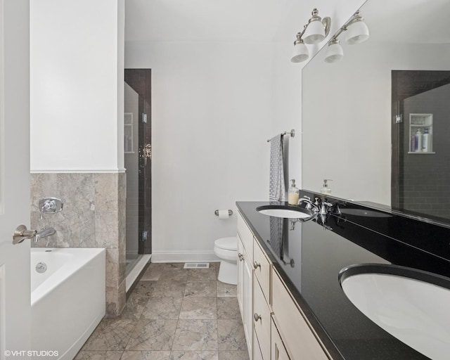 5051 N Clark St Unit 2S, Chicago, IL 60640 - bathroom with double vanity, a bath, and a stall shower
