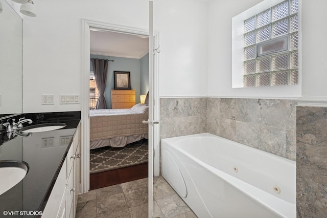 5051 N Clark St Unit 2S, Chicago, IL 60640 - ensuite bathroom featuring a jetted tub, double vanity, and healthy amount of natural light