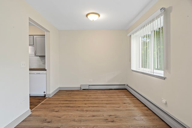 2420 E Brandenberry Ct Unit 2F, Arlington Heights, IL 60004 - unfurnished room with a baseboard radiator, a baseboard heating unit, and wood finished floors