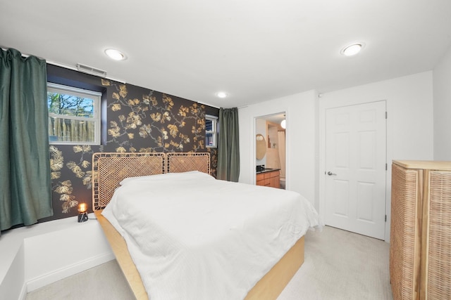 3406 W Medill Ave Unit 1, Chicago, IL 60647 - bedroom with wallpapered walls, baseboards, light carpet, recessed lighting, and connected bathroom