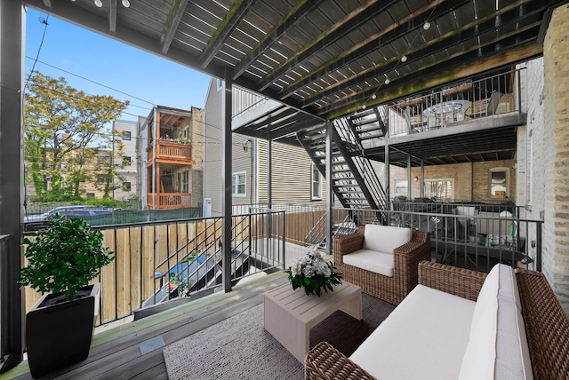 3406 W Medill Ave Unit 1, Chicago, IL 60647 - wooden deck with outdoor lounge area and stairs