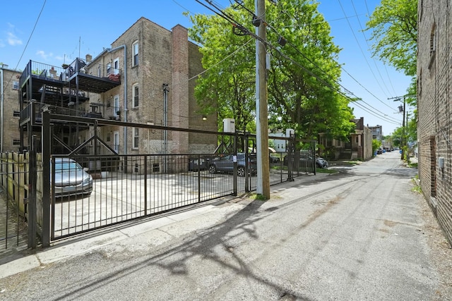 3406 W Medill Ave Unit 1, Chicago, IL 60647 - view of asphalt road featuring a gate