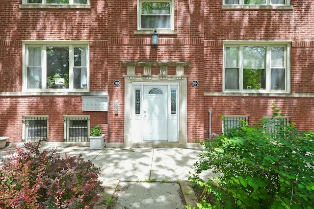 3406 W Medill Ave Unit 1, Chicago, IL 60647 - view of exterior entry featuring brick siding