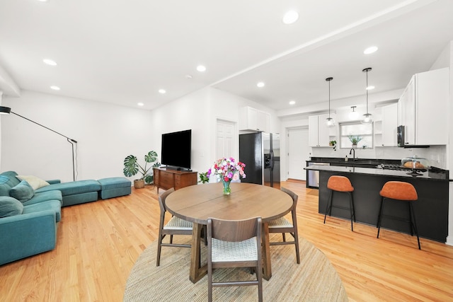 3406 W Medill Ave Unit 1, Chicago, IL 60647 - dining space featuring light wood-style floors and recessed lighting