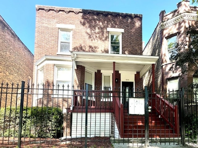 1426 N Central Park Ave, Chicago, IL 60651 - view of front of house featuring brick siding, covered porch, and stairs