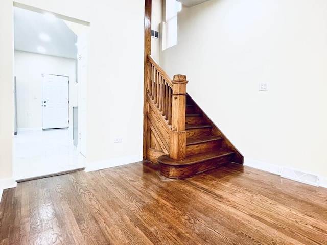 1426 N Central Park Ave, Chicago, IL 60651 - staircase featuring wood finished floors and baseboards