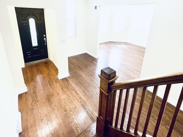 1426 N Central Park Ave, Chicago, IL 60651 - foyer featuring wood finished floors, baseboards, and stairs