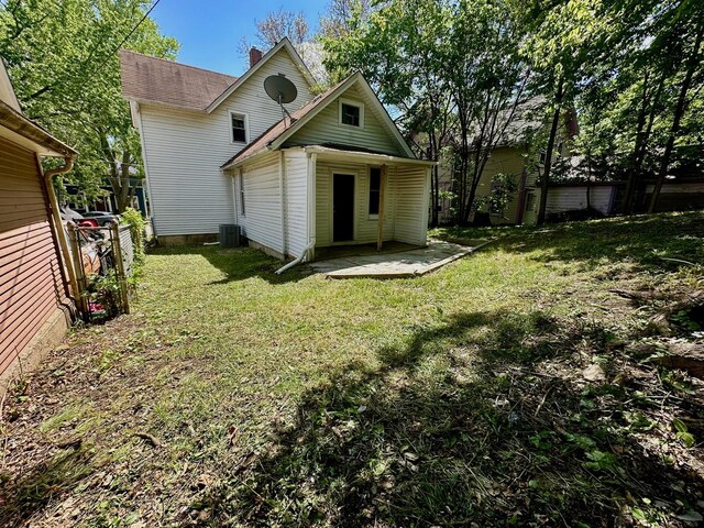 370 N St, Elgin, IL 60120 - rear view of house with a chimney and a patio