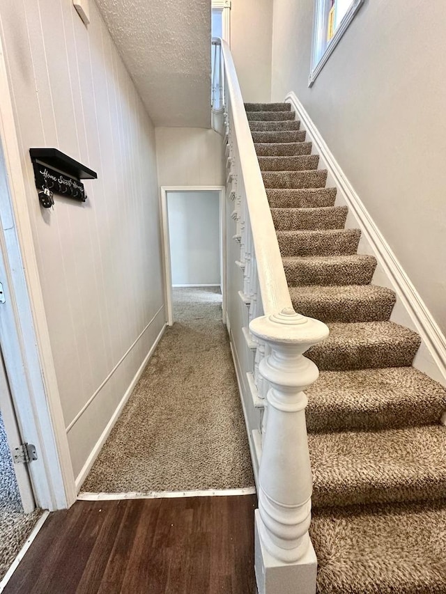 370 N St, Elgin, IL 60120 - stairway featuring wood finished floors and a textured ceiling