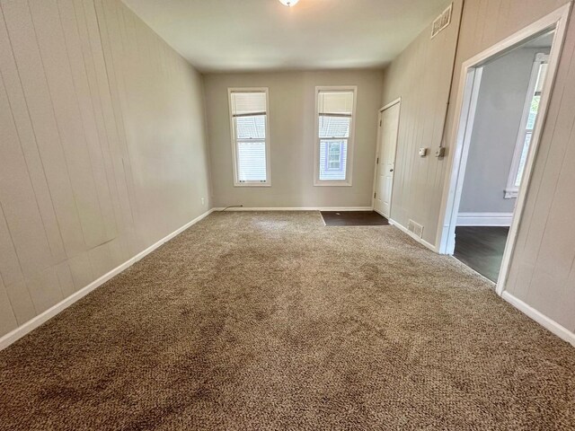 370 N St, Elgin, IL 60120 - spare room with dark colored carpet