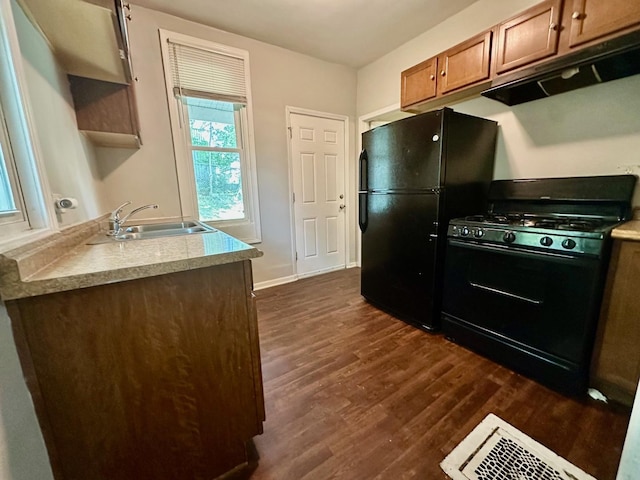 370 N St, Elgin, IL 60120 - kitchen with black appliances, under cabinet range hood, dark wood-type flooring, open shelves, and light countertops
