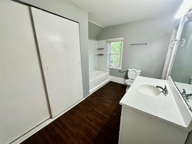 370 N St, Elgin, IL 60120 - bathroom featuring wood finished floors, lofted ceiling, vanity, and  shower combination