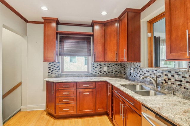 38 Northgate Rd, Riverside, IL 60546 - kitchen with a sink, dishwasher, light stone counters, light wood-style flooring, and ornamental molding