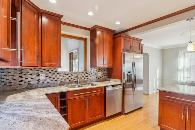 38 Northgate Rd, Riverside, IL 60546 - kitchen with stainless steel appliances, a sink, tasteful backsplash, ornamental molding, and light stone countertops