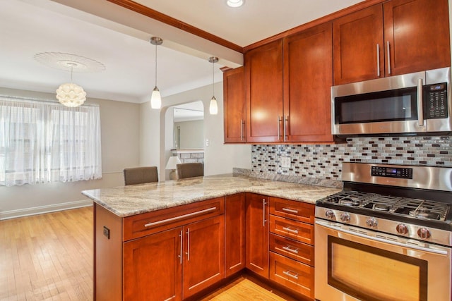 38 Northgate Rd, Riverside, IL 60546 - kitchen featuring appliances with stainless steel finishes, light stone countertops, arched walkways, tasteful backsplash, and light wood finished floors