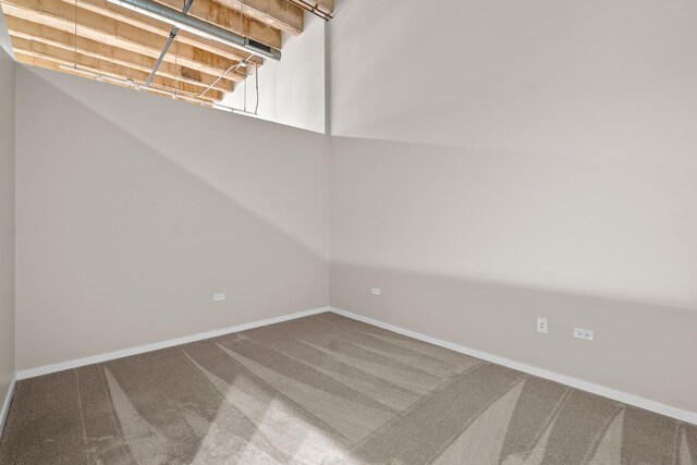 1645 W Ogden Ave Unit 304, Chicago, IL 60612 - carpeted spare room featuring baseboards