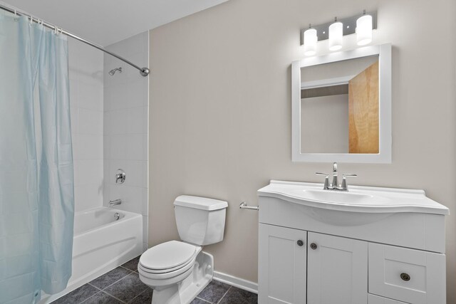 1645 W Ogden Ave Unit 304, Chicago, IL 60612 - bathroom featuring vanity, shower / tub combo, toilet, tile patterned flooring, and baseboards