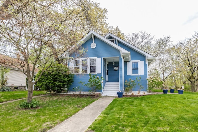 22 W Main St, Glenwood, IL 60425 - bungalow-style house featuring a front yard and a porch