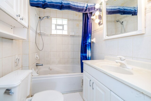 22 W Main St, Glenwood, IL 60425 - bathroom featuring tile walls, toilet, shower / bath combo, and vanity