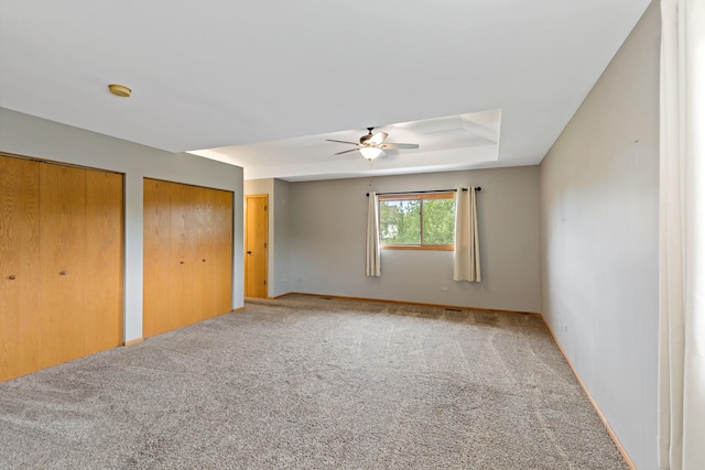 2807 Southwind Dr, New Lenox, IL 60451 - unfurnished bedroom featuring carpet flooring, multiple closets, baseboards, and a ceiling fan