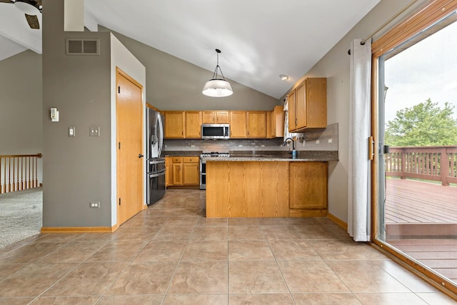 2807 Southwind Dr, New Lenox, IL 60451 - kitchen with stainless steel appliances, lofted ceiling, a peninsula, decorative backsplash, and light tile patterned floors