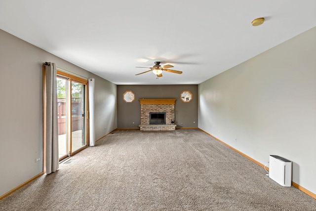 2807 Southwind Dr, New Lenox, IL 60451 - unfurnished living room featuring a ceiling fan, carpet floors, a brick fireplace, and baseboards