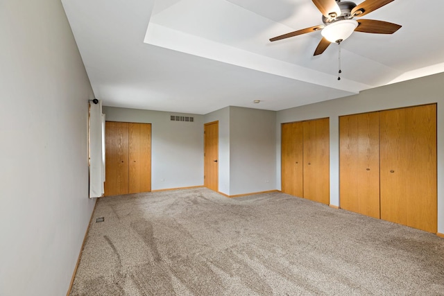 2807 Southwind Dr, New Lenox, IL 60451 - unfurnished bedroom with multiple closets, carpet flooring, baseboards, and ceiling fan