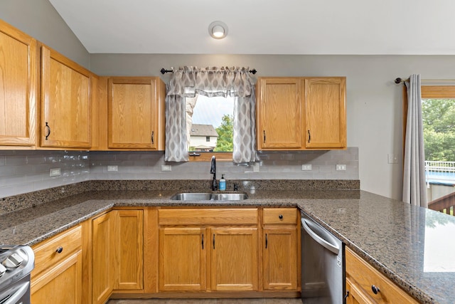 2807 Southwind Dr, New Lenox, IL 60451 - kitchen featuring a sink, appliances with stainless steel finishes, dark stone counters, and backsplash