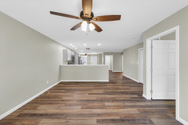 205 E Fairfield St, Fisher, IL 61843 - unfurnished living room featuring ceiling fan, dark wood-type flooring, baseboards, and recessed lighting