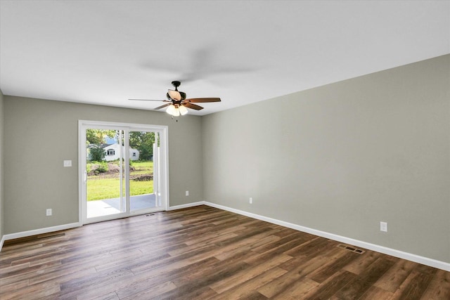 205 E Fairfield St, Fisher, IL 61843 - unfurnished room featuring dark wood-type flooring, baseboards, and a ceiling fan