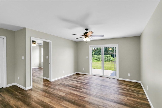 205 E Fairfield St, Fisher, IL 61843 - empty room with dark wood finished floors, a ceiling fan, and baseboards
