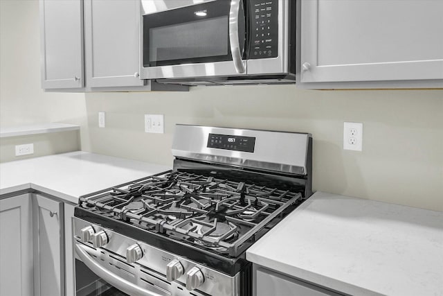 205 E Fairfield St, Fisher, IL 61843 - kitchen with stainless steel appliances and light countertops