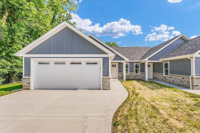 205 E Fairfield St, Fisher, IL 61843 - view of front of home with stone siding, driveway, a front yard, and roof with shingles