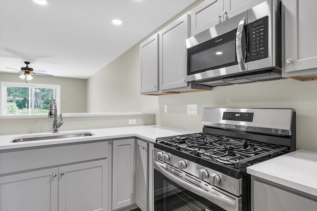205 E Fairfield St, Fisher, IL 61843 - kitchen with appliances with stainless steel finishes, a sink, light countertops, a ceiling fan, and recessed lighting