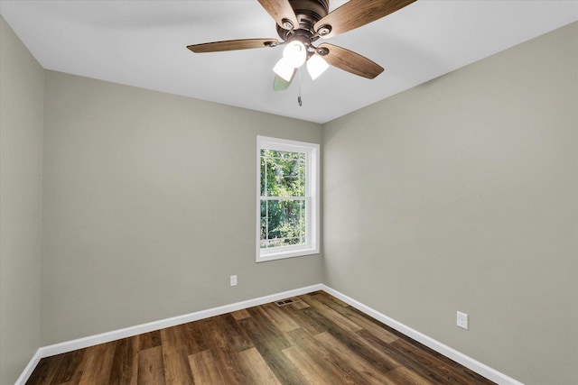 205 E Fairfield St, Fisher, IL 61843 - spare room with baseboards, dark wood finished floors, and ceiling fan