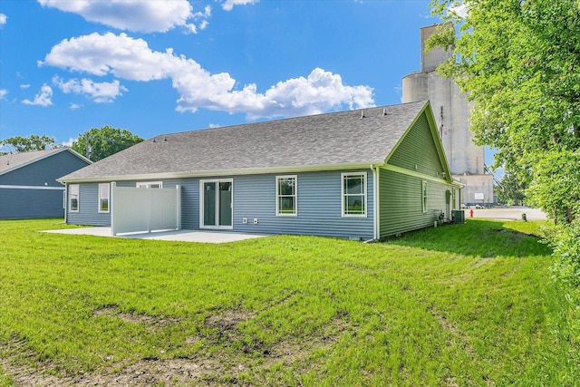 205 E Fairfield St, Fisher, IL 61843 - back of property featuring a patio, a chimney, a lawn, and central air condition unit