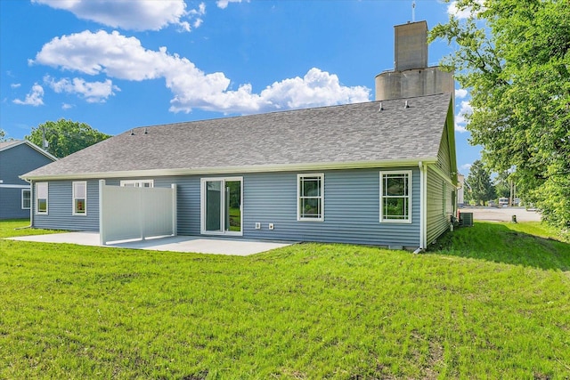 205 E Fairfield St, Fisher, IL 61843 - back of property with a patio, a yard, a chimney, and cooling unit