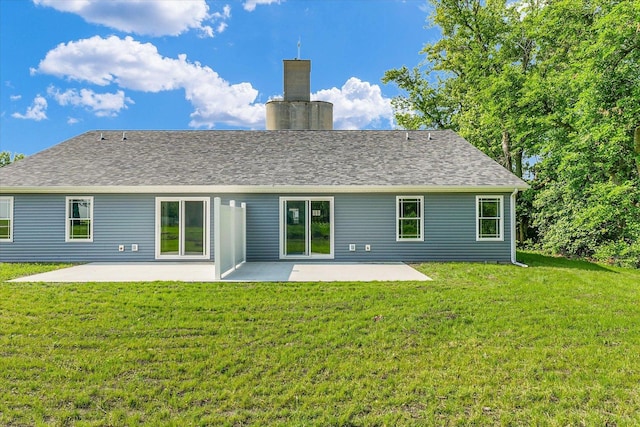 205 E Fairfield St, Fisher, IL 61843 - back of property with a patio area, a yard, and a chimney