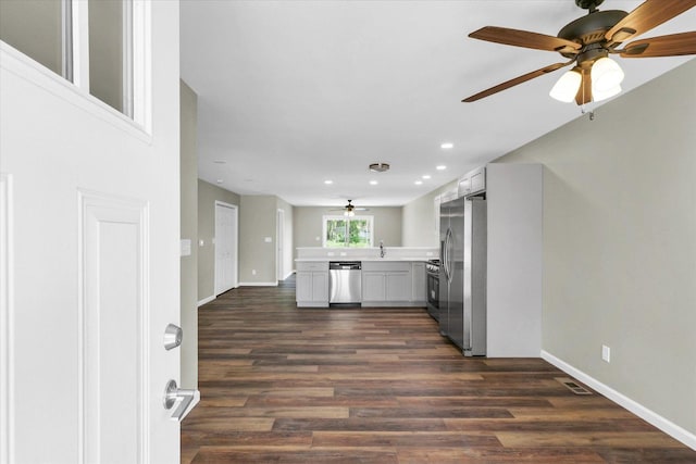 205 E Fairfield St, Fisher, IL 61843 - kitchen featuring appliances with stainless steel finishes, dark wood-style flooring, a ceiling fan, light countertops, and recessed lighting