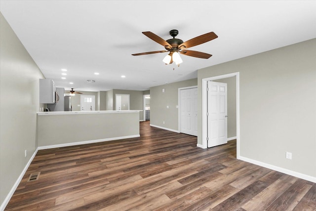 205 E Fairfield St, Fisher, IL 61843 - unfurnished living room with a ceiling fan, baseboards, dark wood-style floors, and recessed lighting