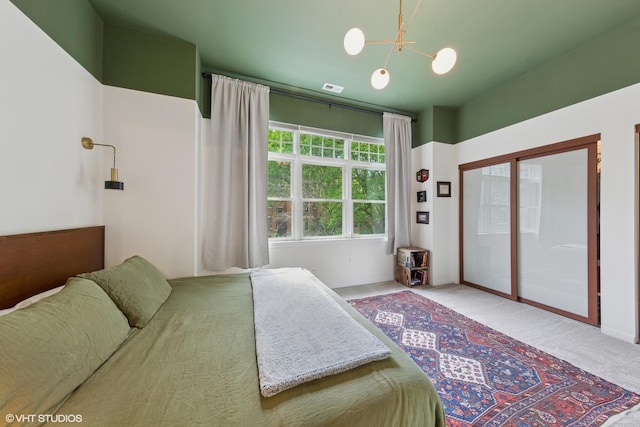 1615 N Oakley Ave Unit 2S, Chicago, IL 60647 - bedroom featuring a chandelier and carpet floors