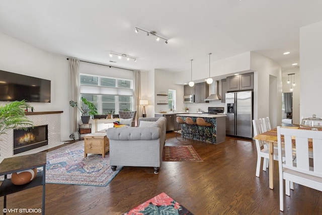 1615 N Oakley Ave Unit 2S, Chicago, IL 60647 - living area with dark wood-style flooring, a tile fireplace, and recessed lighting