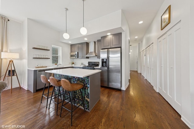 1615 N Oakley Ave Unit 2S, Chicago, IL 60647 - kitchen with appliances with stainless steel finishes, wall chimney range hood, gray cabinets, dark wood-type flooring, and recessed lighting