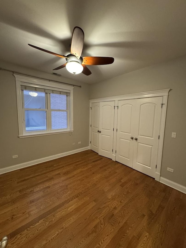 1304 N Wood St Unit 2, Chicago, IL 60622 - unfurnished bedroom featuring baseboards, dark wood finished floors, ceiling fan, and a closet
